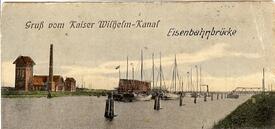 ca. 1912 Kaiser-Wilhelm Kanal (NOK) Schleppverband passiert die Eisenbahn-Drehbrücke Taterpfahl